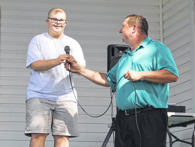 
			
				                                Event guest Coleman speaks and sings to the crowd during the Special Olympics golf tournament hosted by the Anson County Sheriff’s Department on Oct. 28.
 
			
		