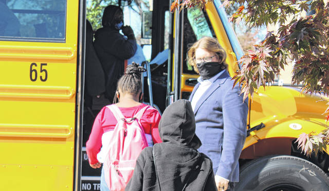 
			
				                                Wadesboro Elementary Principal Daniel Burrows helps students load the buses during the first day back on Nov. 2. 
 
			
		