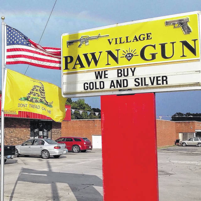 
			
				                                Village Pawn & Gun Shop sells, buys and trades guns, ammo, gold and jewerly. The shop is experiencing long lines out the door as more and more customers are coming in to purchase guns. 
                                 Contributed Photo

			
		