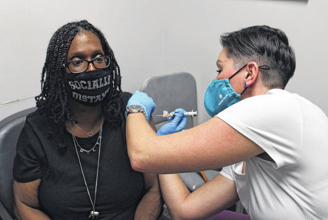 
			
				                                Evadne Smith, employee of Smith’s Funeral Home, receives the first dose of her COVID-19 vaccine on Jan. 4 at the Anson County Health Department.
                                 Liz O’Connell | Anson Record

			
		