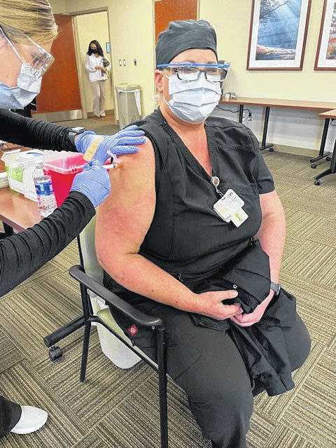 
			
				                                Atrium Health Anson employee Tracy Osborne receives the first dose of the Moderna vaccine on Jan. 12. 
                                 Contributed Photo

			
		