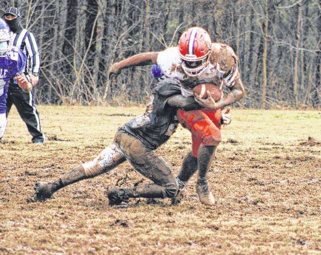 
			
				                                Anson running back breaks a tackle from Albemarle during an hour-long scrimmage game on Feb. 19.
                                 Liz O’Connell | Anson Record

			
		