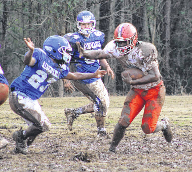 
			
				                                The Bearcats run the ball through a muddy scrimmage on Feb. 19 against Albemarle.
                                 Liz O’Connell | Anson Record

			
		