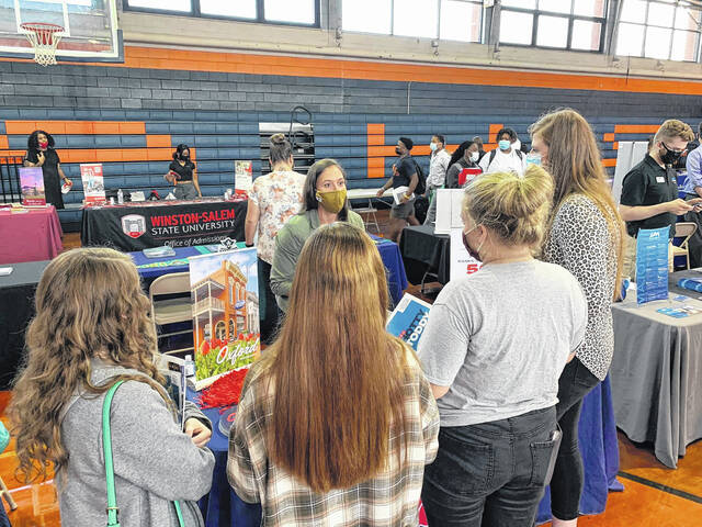 
			
				                                Students listen to a college representative at the College Fair hosted by Anson High School for juniors and seniors to prepare to apply to college. Higher ed representatives from all over the country visited including East Carolina, South Piedmont Community College, Coastal Carolina, The Citadel, and Ole Miss. “The seniors and juniors are steps closer to deciding their futures,” wrote Anson High School on Facebook. The school thanked 72 colleges who attended to recruit their students.
                                 Contributed photo

			
		