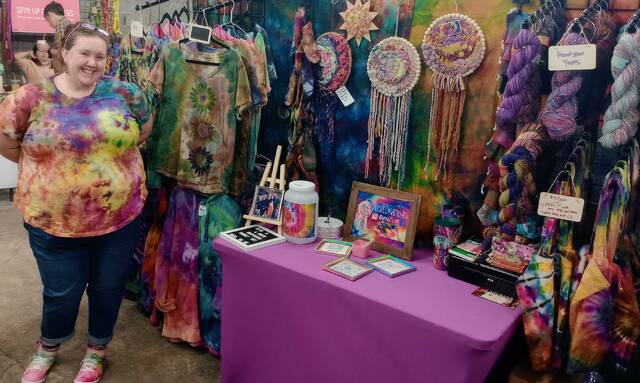 <p>Owner of NickleMadigan, Erin Elledge, proudly showcases her colorful wares at the 2023 Fiber Arts Festival.</p>
                                 <p>Lauren Monica | Anson Record</p>