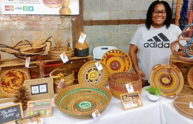 <p>Owner of Handwork’s by Shakeeka, Shakeeka Brooks, exhibits her delicately crafted baskets. Brooks started learning how to make baskets while at Wingate University. It came naturally to her and she now offers classes for groups and ladies night out.</p>
                                 <p>Lauren Monica | Anson Record</p>