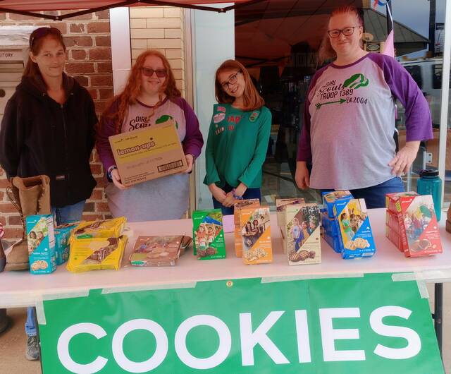 <p>Representing Troop 1389, Christy McFalls, Cheyenne Hassell, Robin Helms, and Cynthia Hassell, braved the rainy weather to get those highly coveted cookie boxes into the eagerly waiting hands of hungry Ansonians! The Girl Scouts will be selling cookies every Saturday through February 17. </p>
                                 <p>Lauren Monica | Anson Record</p>
